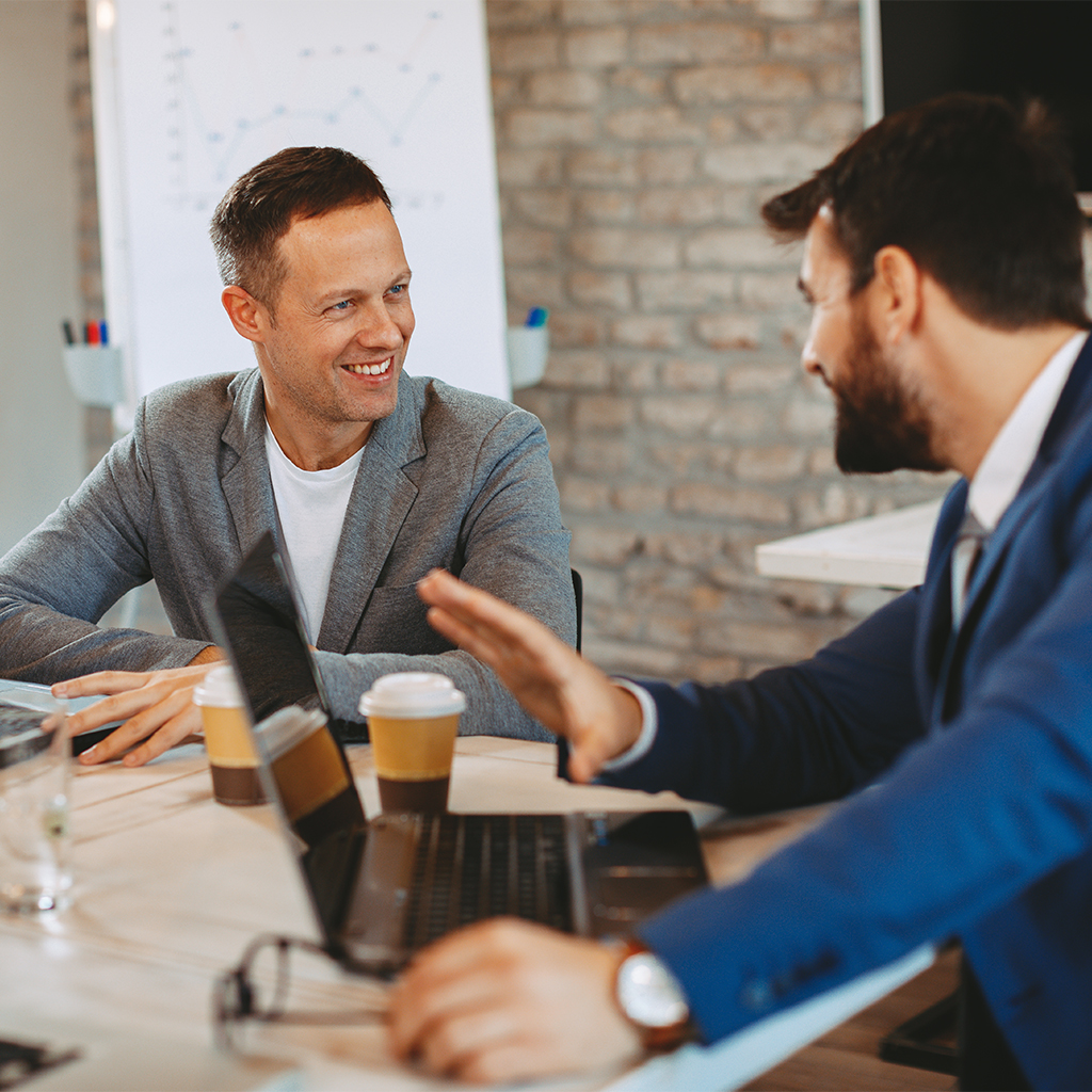 two-business-men-communicate-in-the-office-at-the-2023-04-06-19-55-49-utc